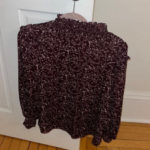 Purple mock neck blouse with white flowery design